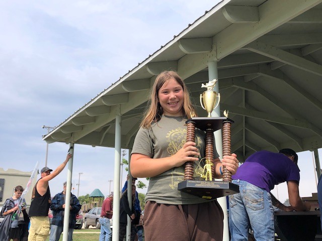 Photo of fishing derby contestant with trophy
